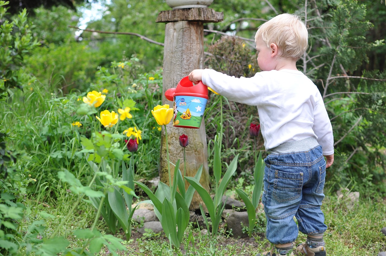 Kid watering the garden