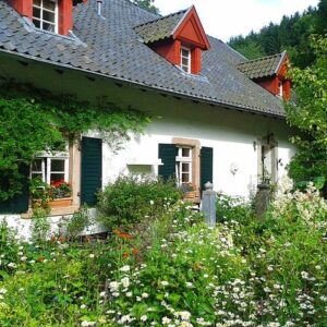 Cottage flower garden with white cottage